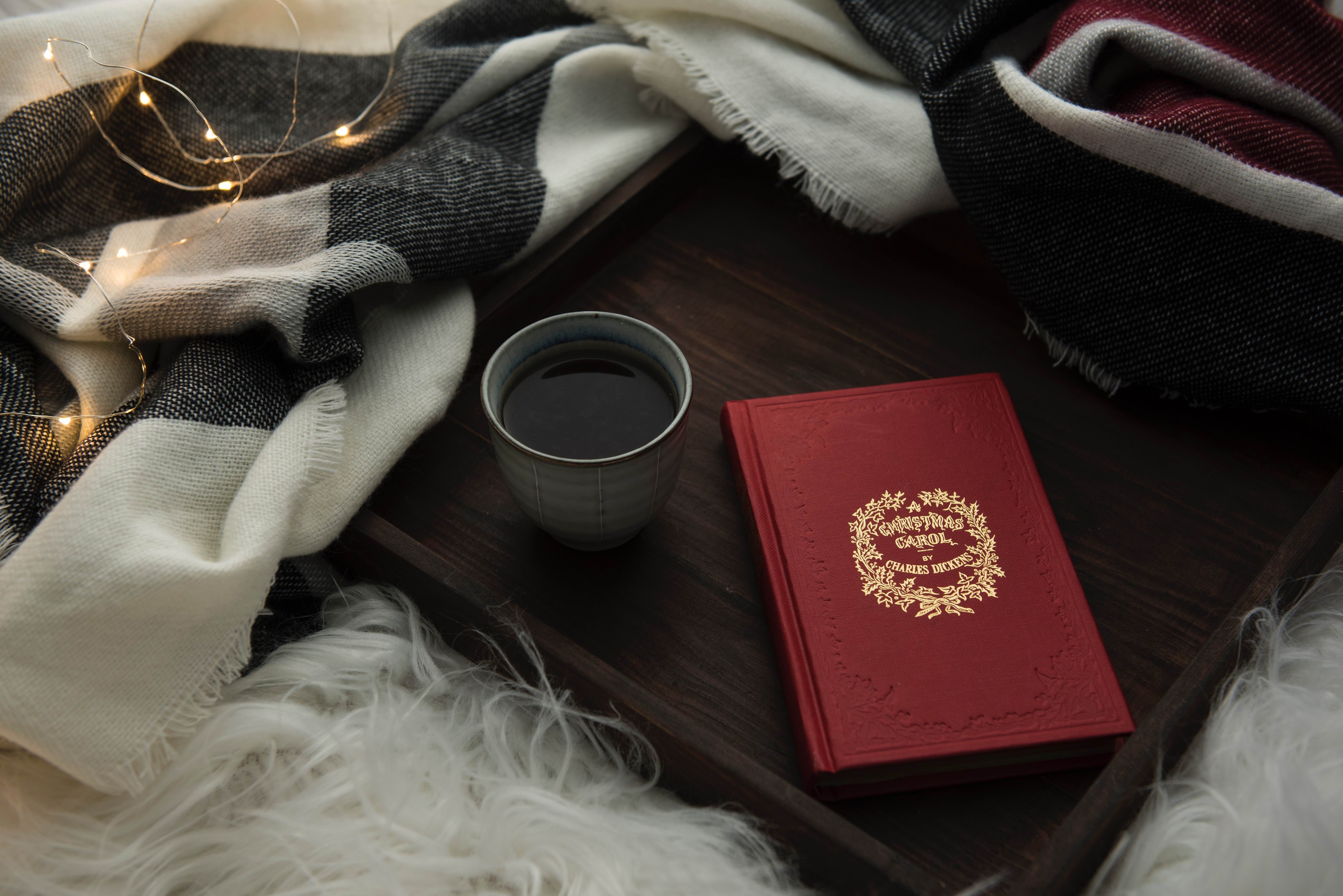 CHRISTMAS CAROL BOOK &amp; COFFEE - Photo by Joanna Kosinska on Unsplash